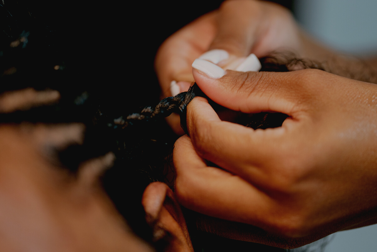 Man with Curly Hair Getting Braids