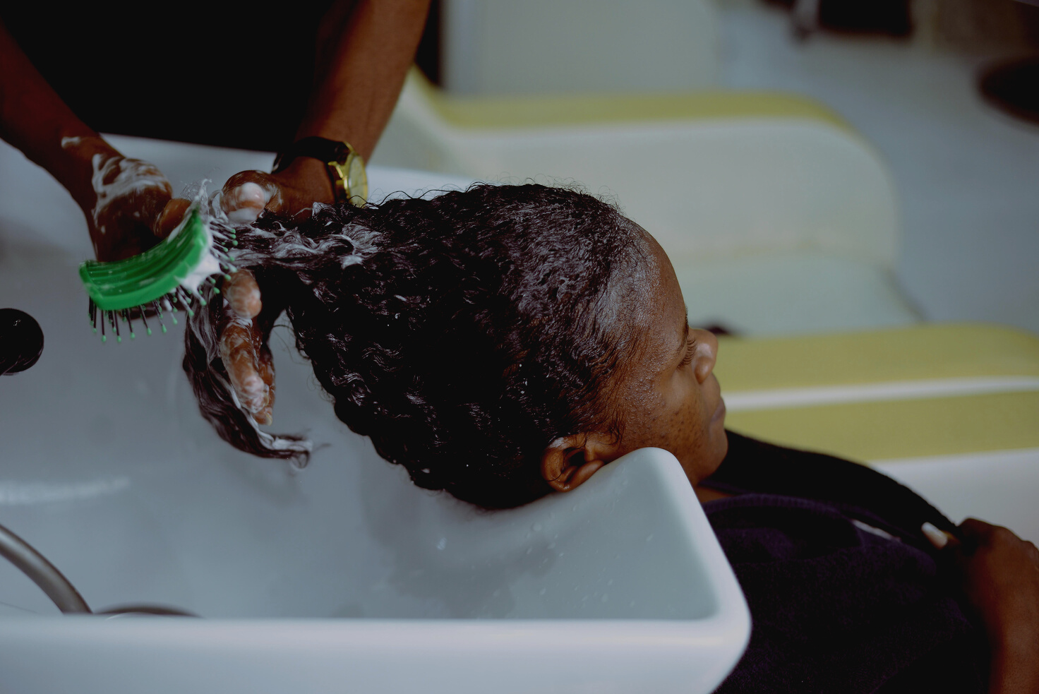 Washing Woman Hair at Hairdresser